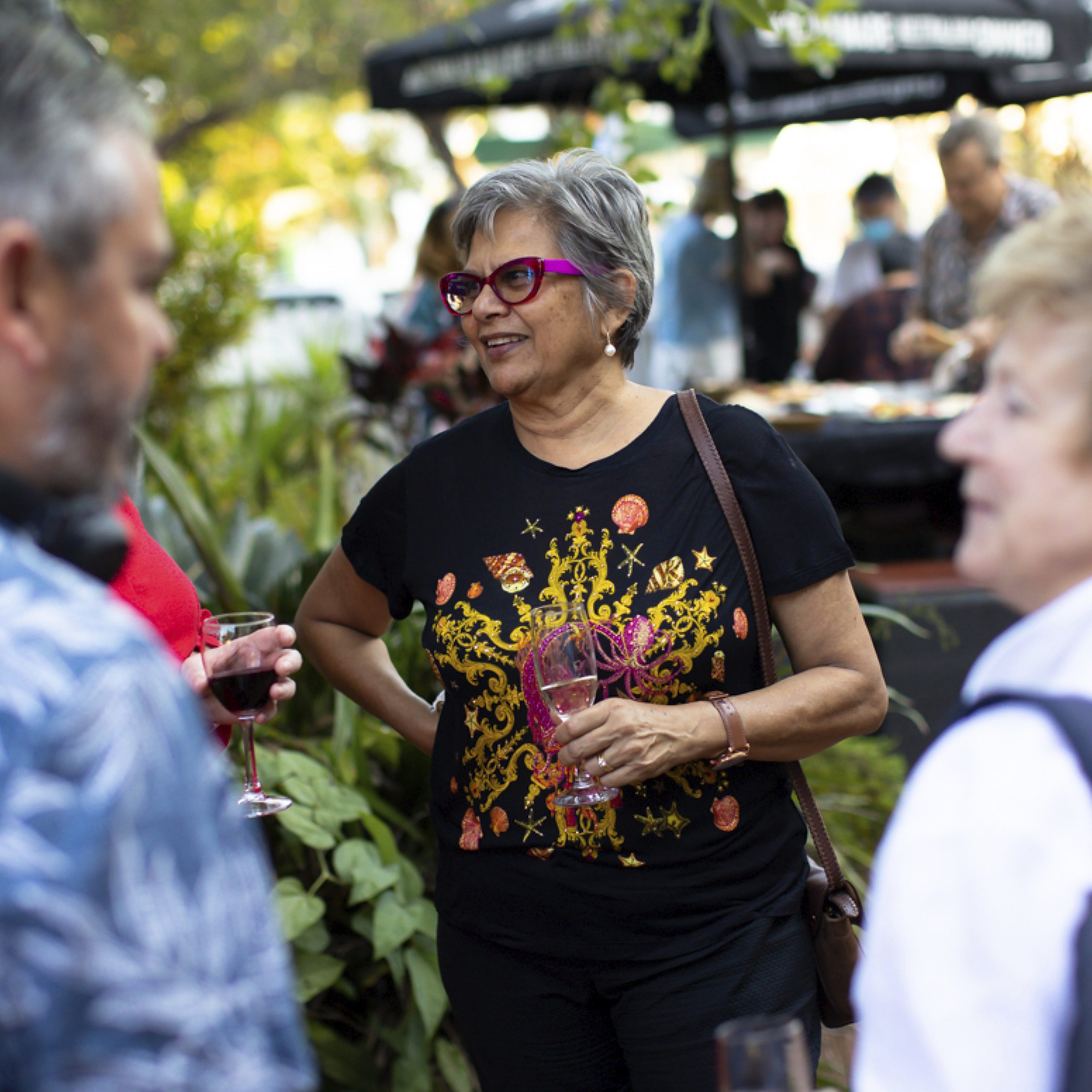 Photograph of people standing around the Brown's Mart Courtyard talking