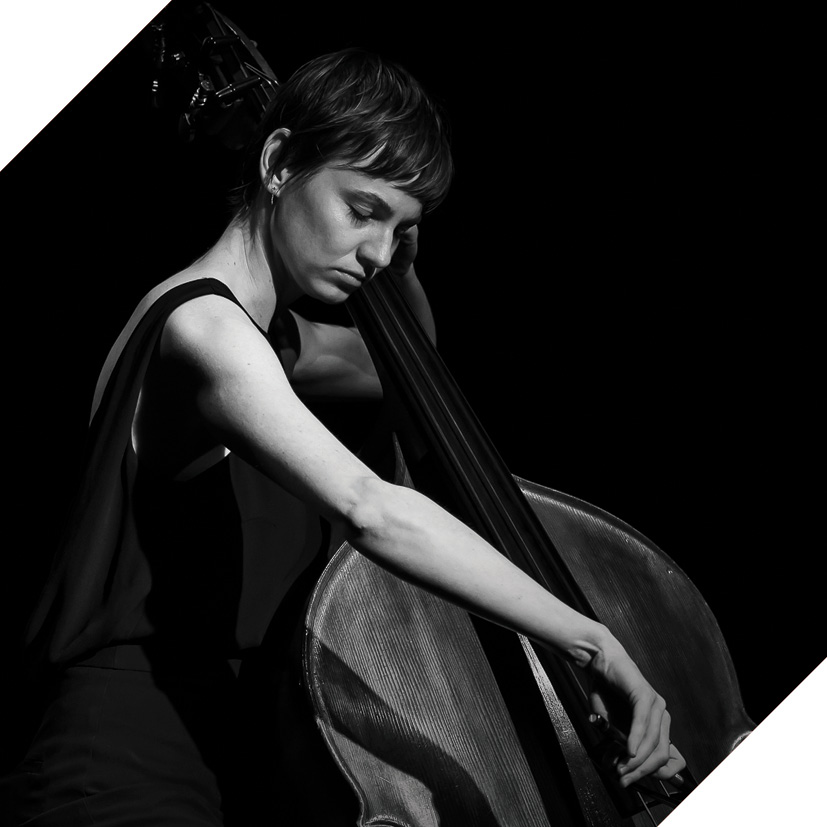 Photograph of musician Rhiannon Oakhill-Steel playing a double bass