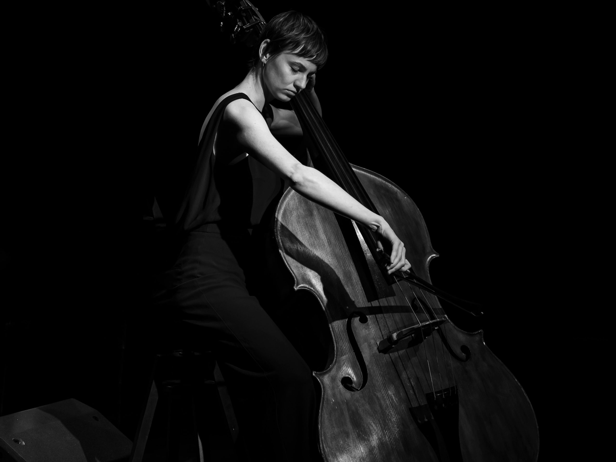 Photograph of musician Rhiannon Oakhill-Steel playing a double bass