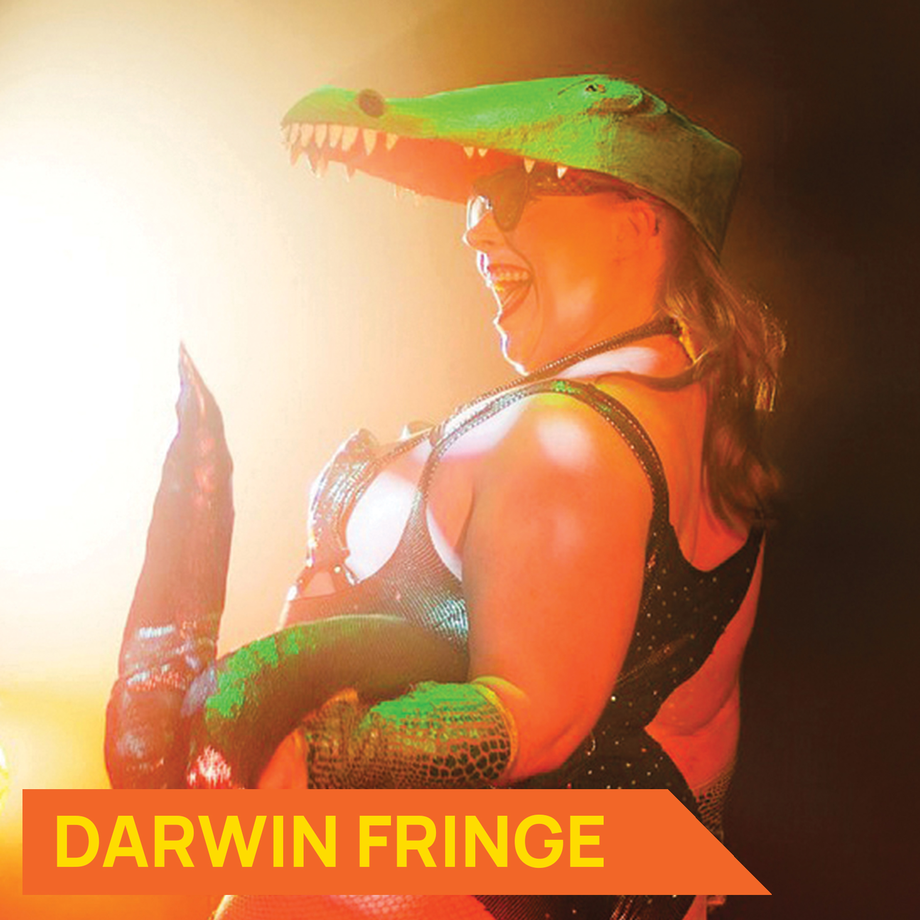 Photograph of performer Millie Divine dressed as a crocodile