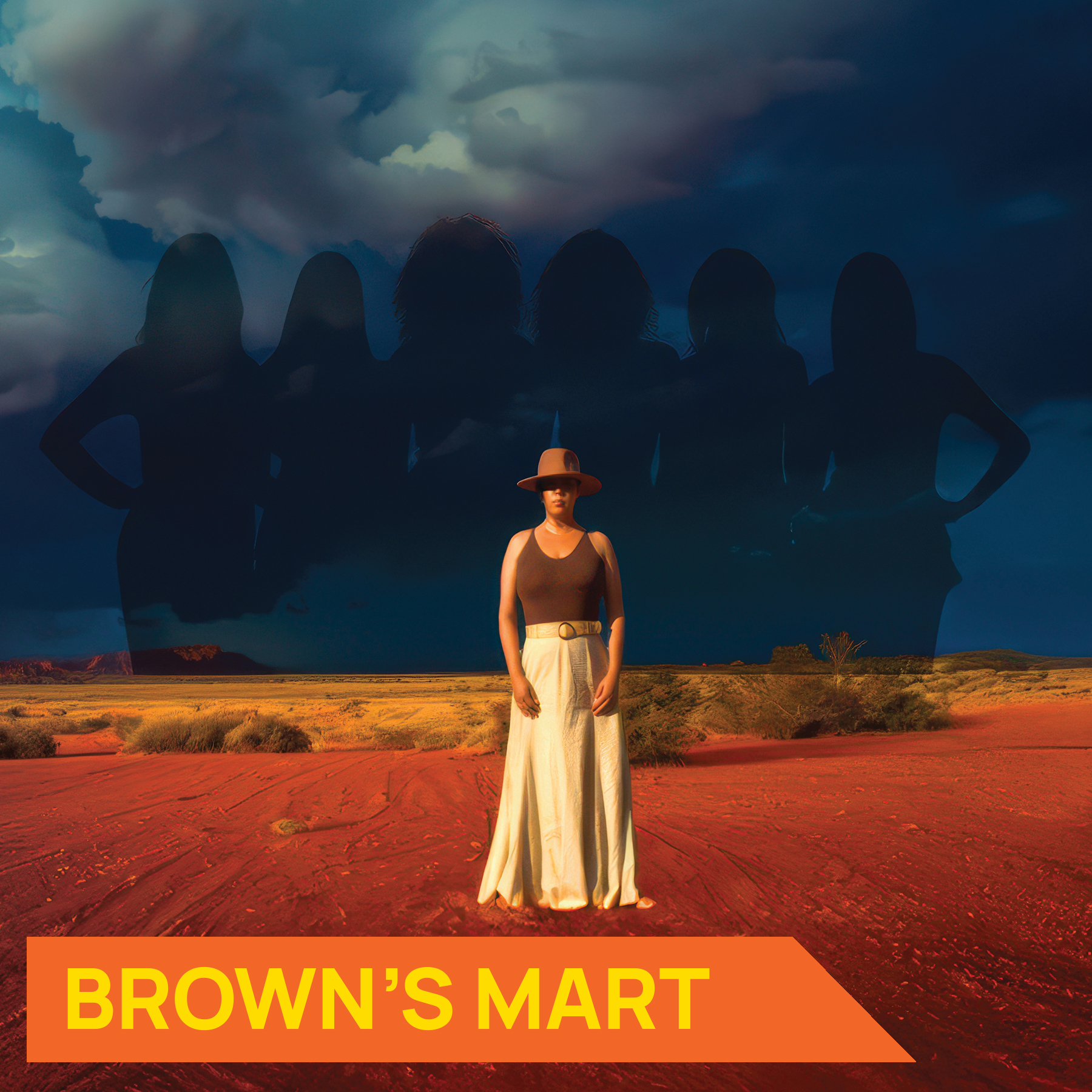 Photograph of Writer and Director Yvette Walker on a red dirt plain with a storm in the background