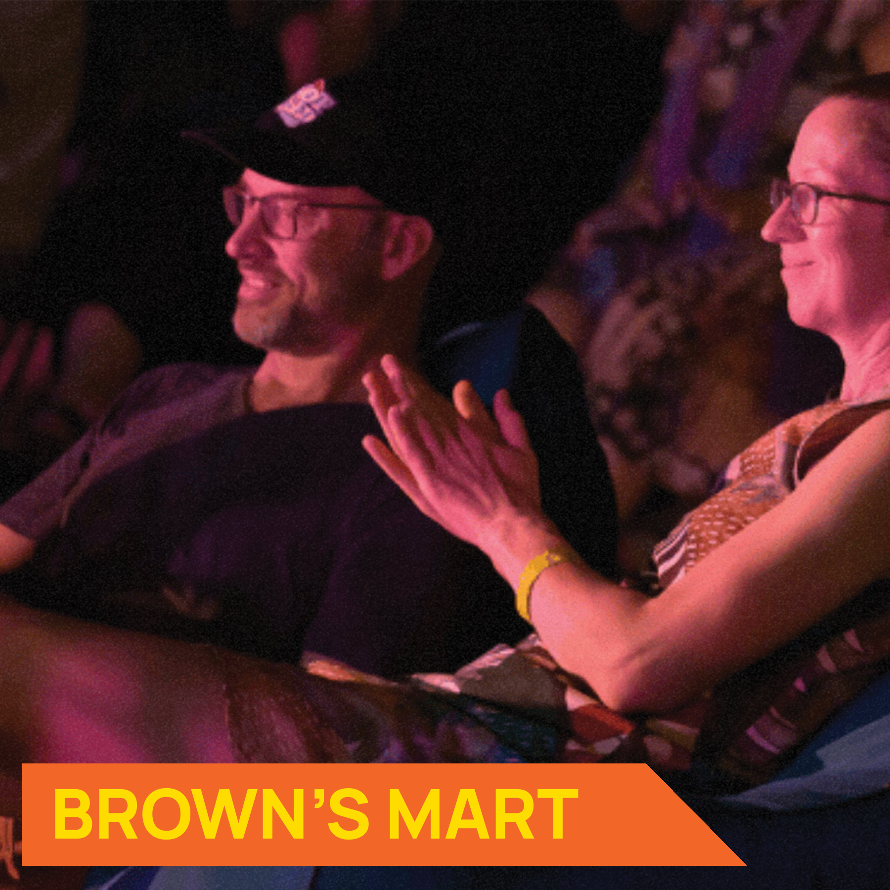 Photo of people sitting down enjoying a show